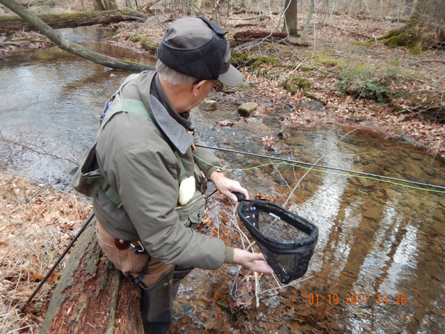 DSCN1832.jpg -                                Ed is getting ready to return the fish to the stream.