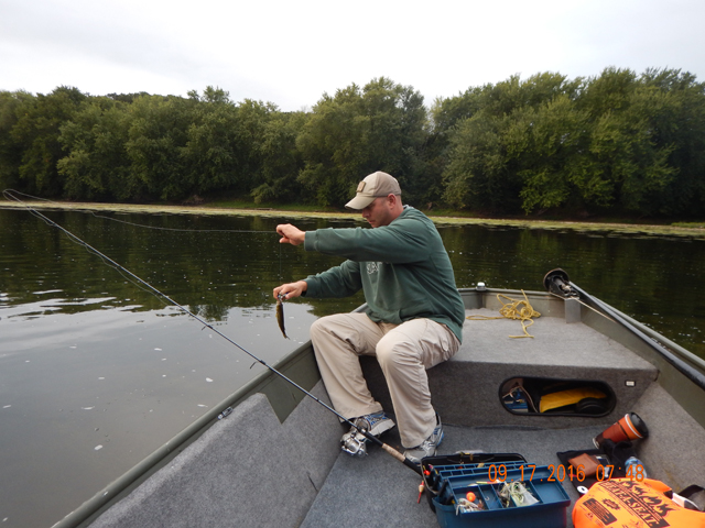 DSCN1673.jpg -                    Dave really has a problem handling fish.  But, he was catching and that's what counts.            