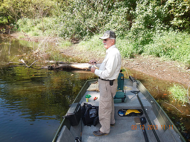 DSCN0117.jpg -                                Ed playing with the little ones.  We caught bunches.  Mostly bass.