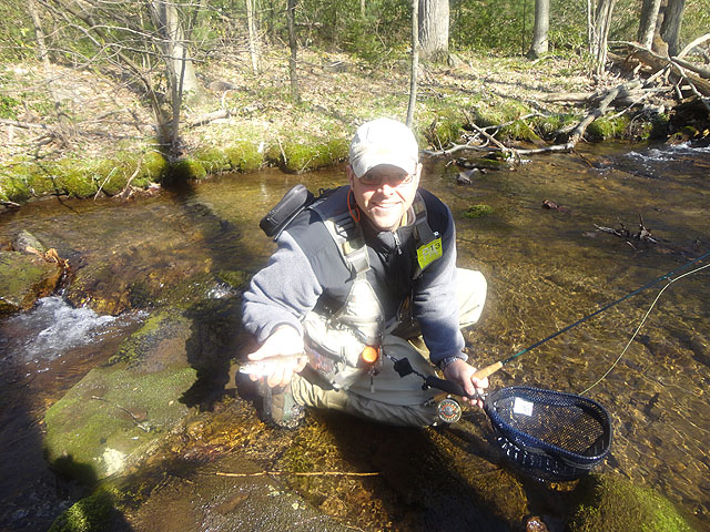 DSC01483.jpg -                                Gary with one of many wild trout.