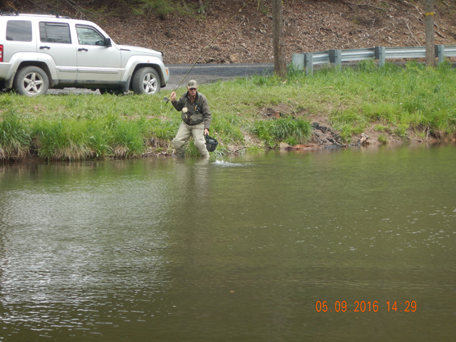 17.jpg -                                Ed made it from the vehicle to the stream side.  Short walk and presto, a fish.