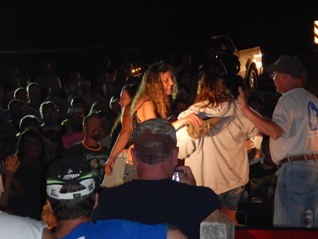 DSCN0260.jpg -                                There were a number of women who joined the event in the back of the pickup.