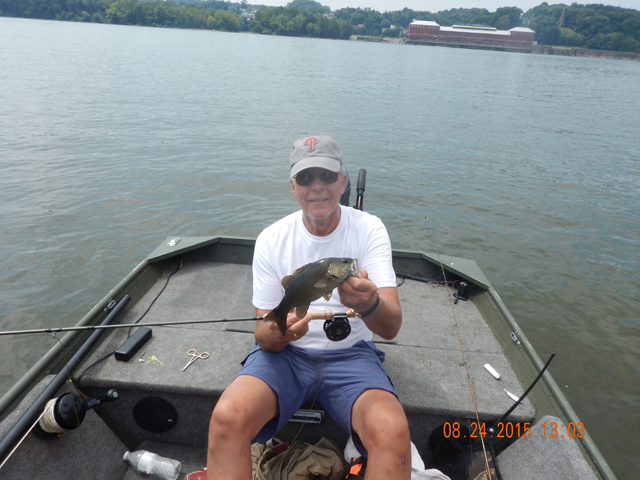 DSCN0597.jpg -                                Then, still on the Clousers, we started to catch bass.  This one wasn't too bad.